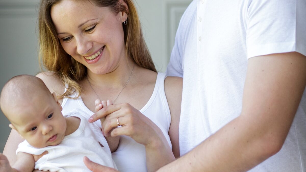 happy young family with baby child