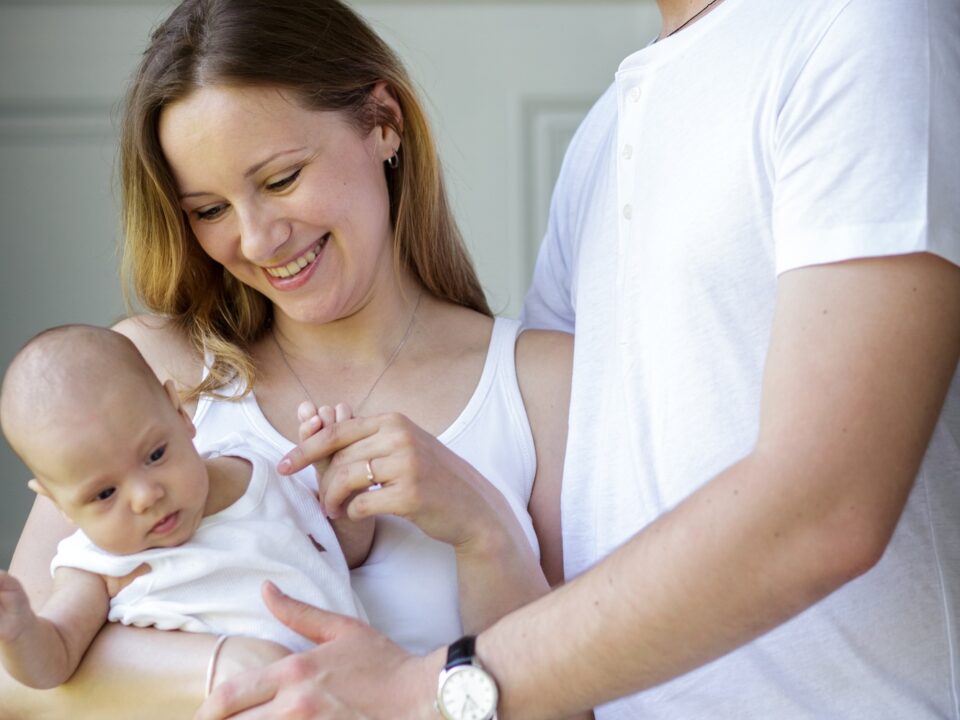 happy young family with baby child